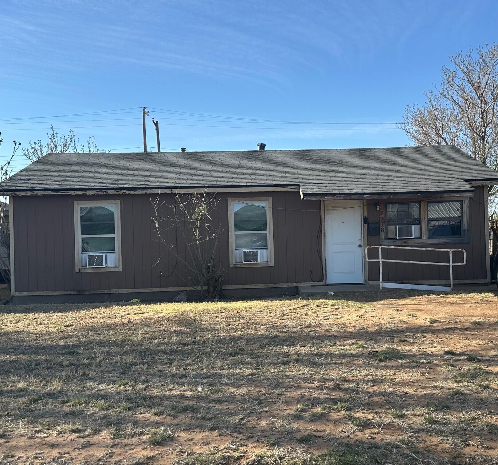 2718 East 10th Street Lubbock, TX 79403 - Photo 1 of 9 a house that has a big yard