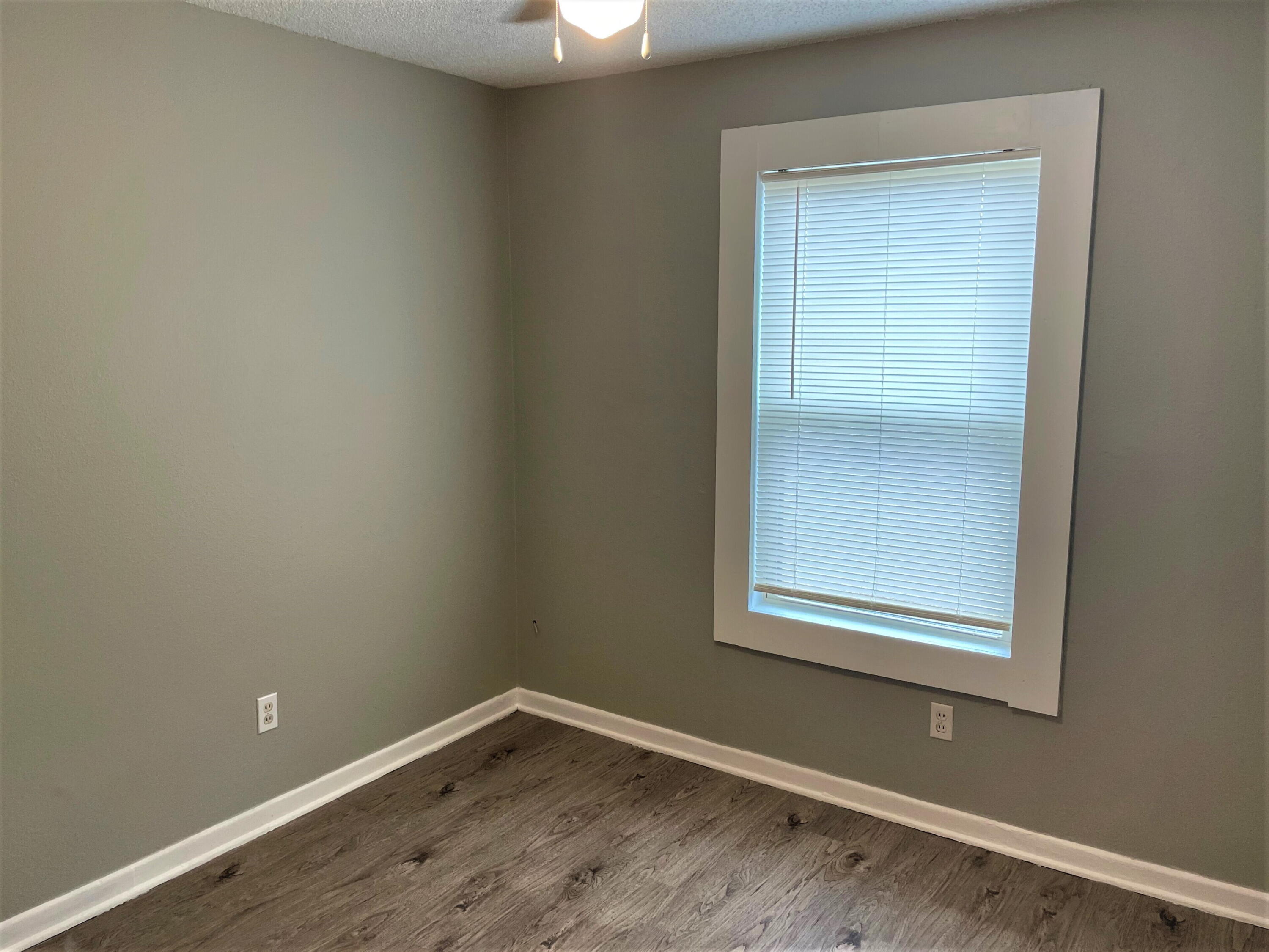 2718 East 10th Street Lubbock, TX 79403 - Photo 3 of 9 an empty room with a window