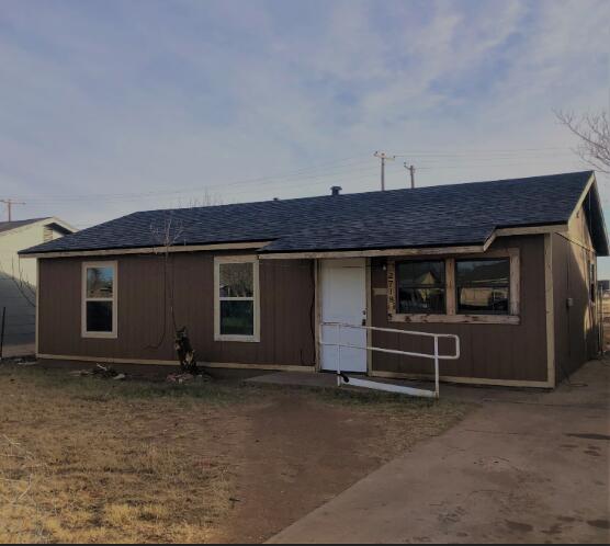 2718 East 10th Street Lubbock, TX 79403 - Photo 7 of 9 a view of a house with a flat screen tv and outdoor space