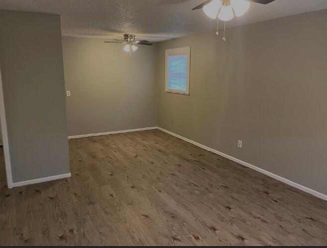 2718 East 10th Street Lubbock, TX 79403 - Photo 8 of 9 en empty room with wooden floor