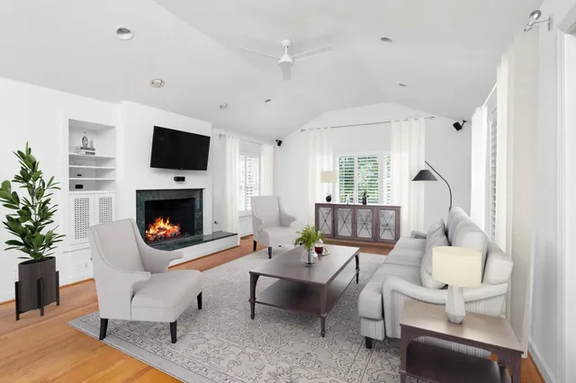 a bathroom with a sink mirror and toilet