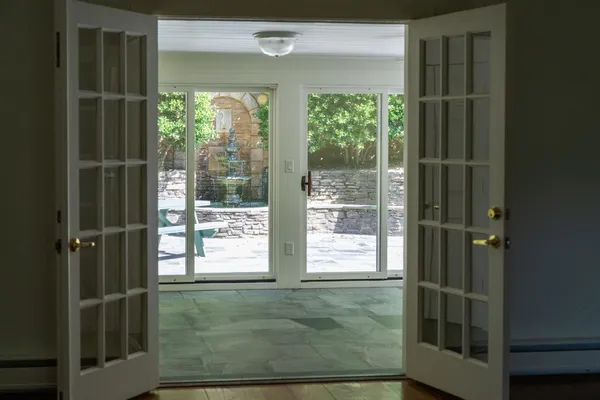 a view of an empty room with a window