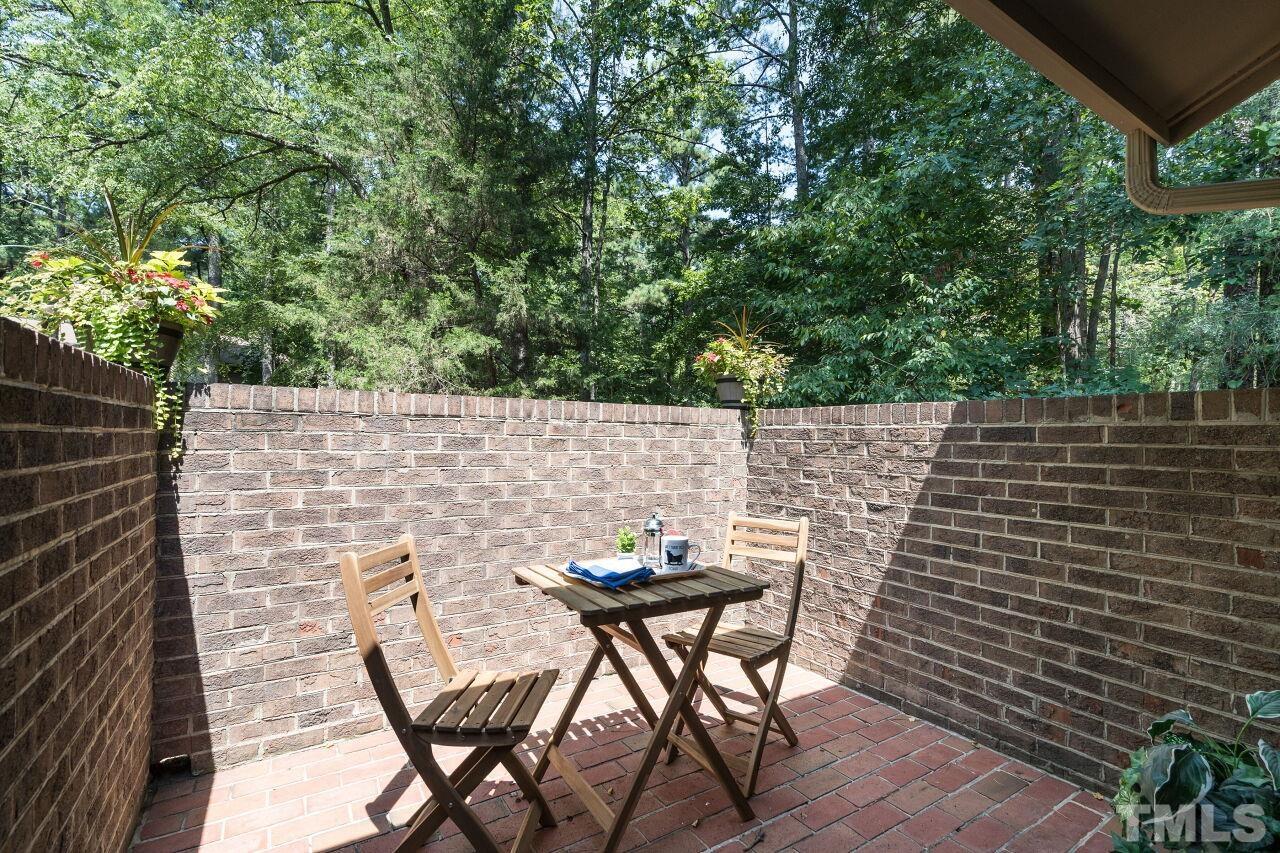 87 Stoneridge Road Durham, NC 27705 - Photo 16 of 29 a backyard of a house with table and chairs