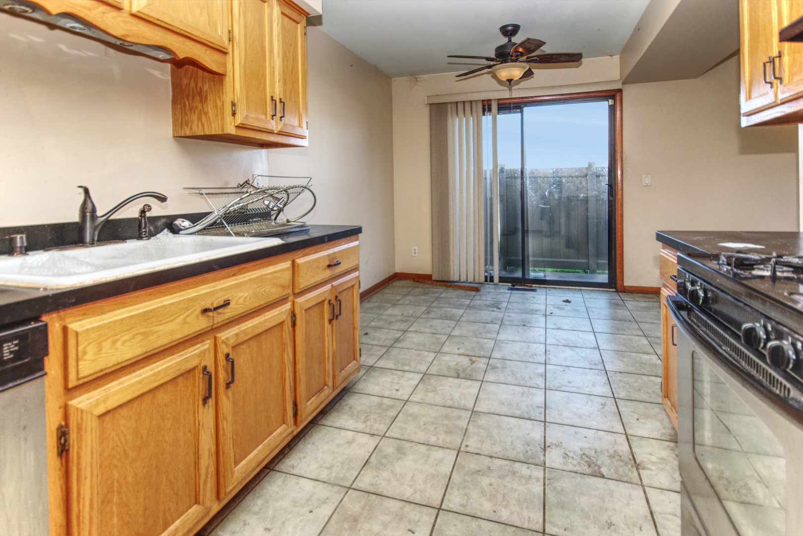 701 Tauber Road, Unit 701 New Lenox, IL 60451 - Photo 5 of 15 a kitchen with stainless steel appliances granite countertop a sink stove and cabinets