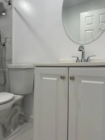 a bathroom with a toilet and a sink