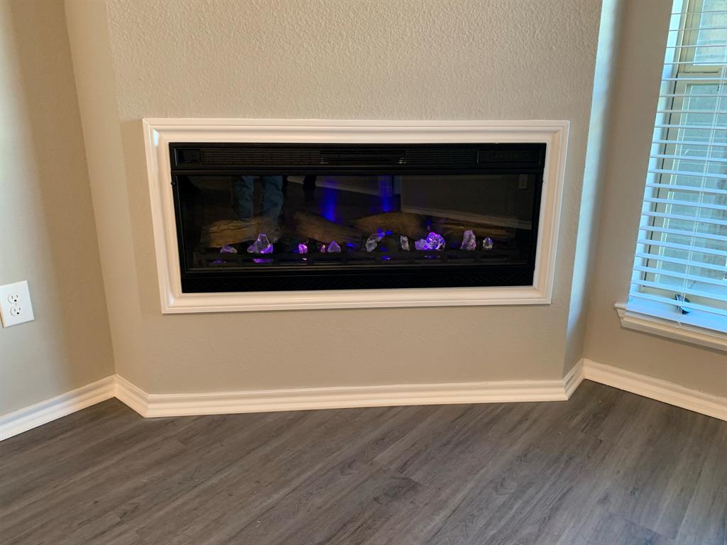 6108 Abrams Road, Unit 514 Dallas, TX 75231 - Photo 5 of 9 a room with a fireplace