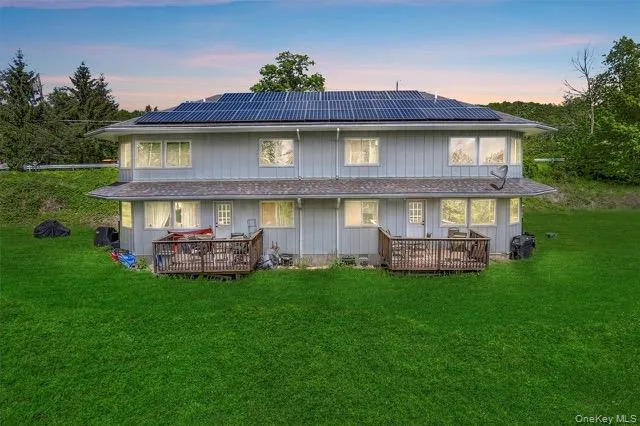 a view of a house with a yard porch and sitting area