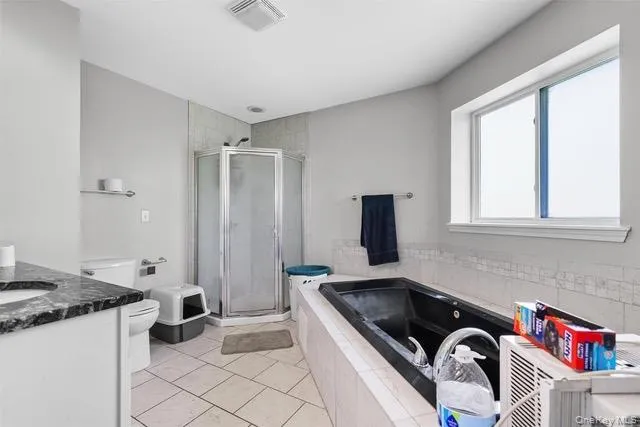 a kitchen that has a sink and a stove in it