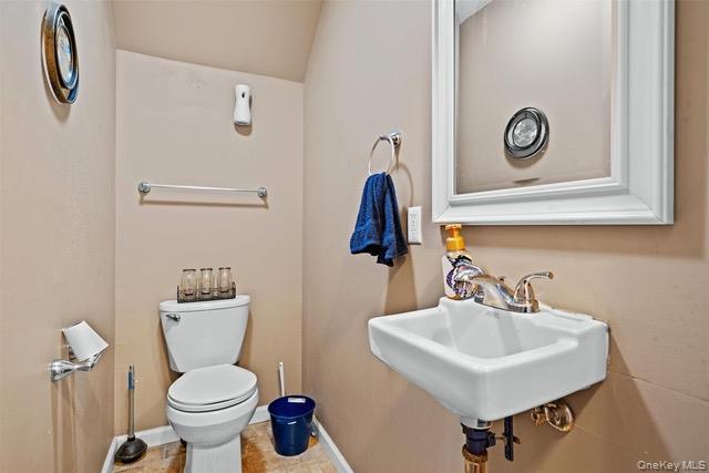 448 Old Mountain Road Port Jervis, NY 12771 - Photo 25 of 29 a bathroom with a toilet sink and mirror