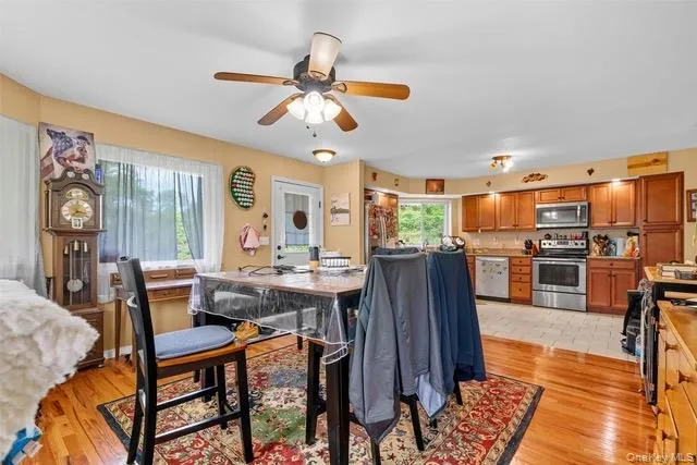 a view of a dining room with furniture window and wooden floor