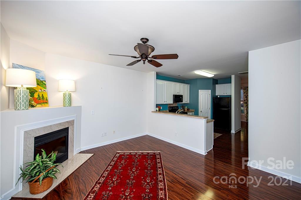 1135 Market Street, Unit 552 Fort Mill, SC 29708 - Photo 9 of 27 a living room with furniture and a fireplace