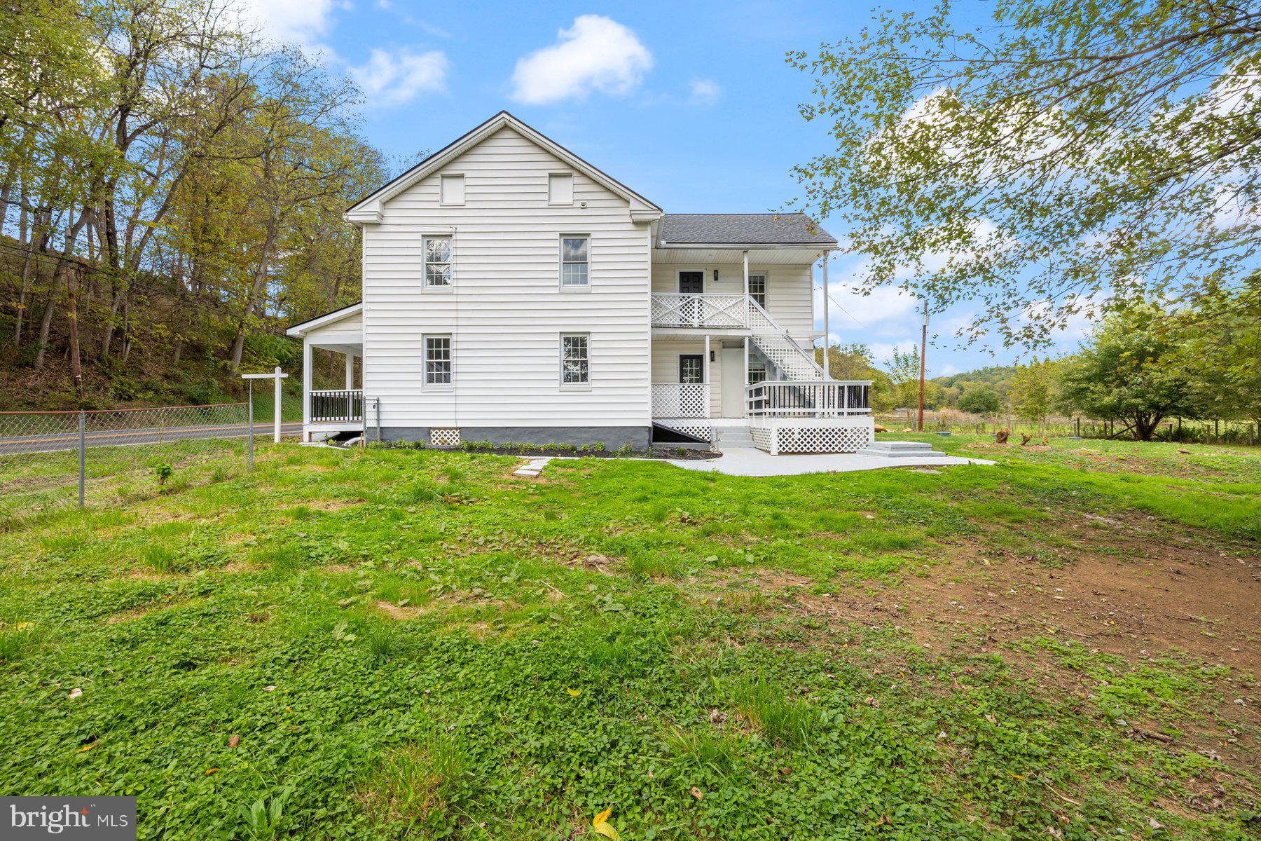 8109 Old Hagerstown Road Middletown, MD 21769 - Photo 28 of 54 a view of a house with a yard and sitting area