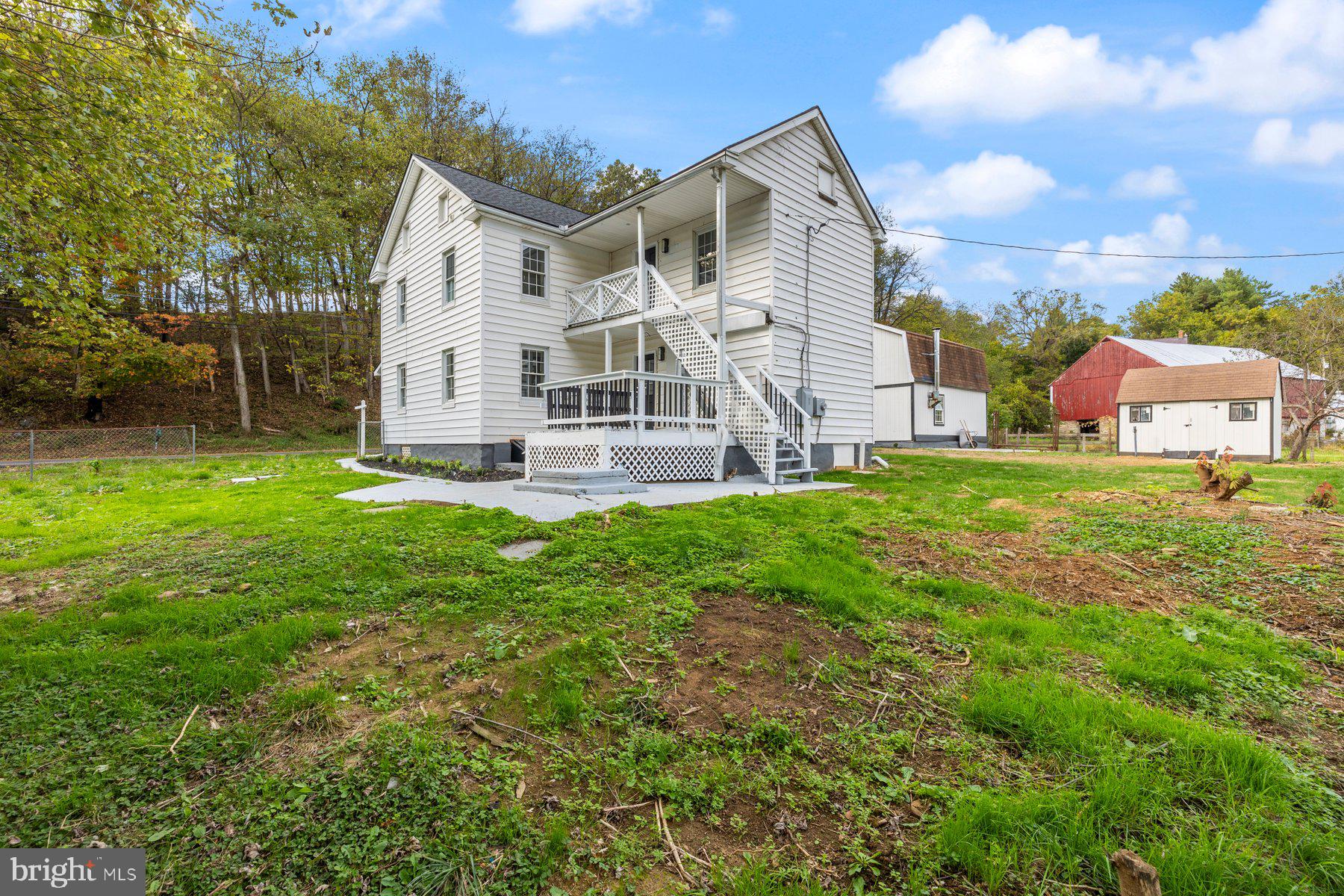 8109 Old Hagerstown Road Middletown, MD 21769 - Photo 30 of 54 a view of a house with a yard and sitting area