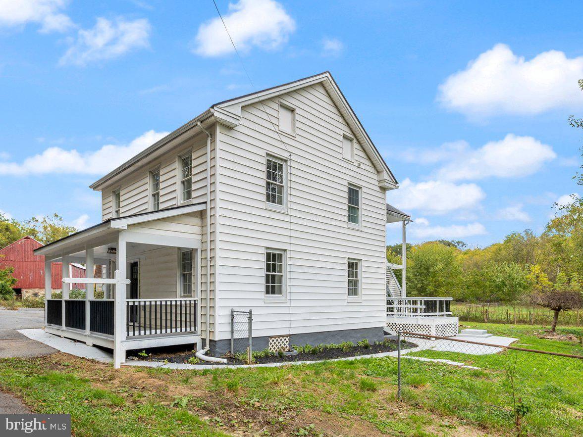 8109 Old Hagerstown Road Middletown, MD 21769 - Photo 39 of 54 a view of a house with a yard