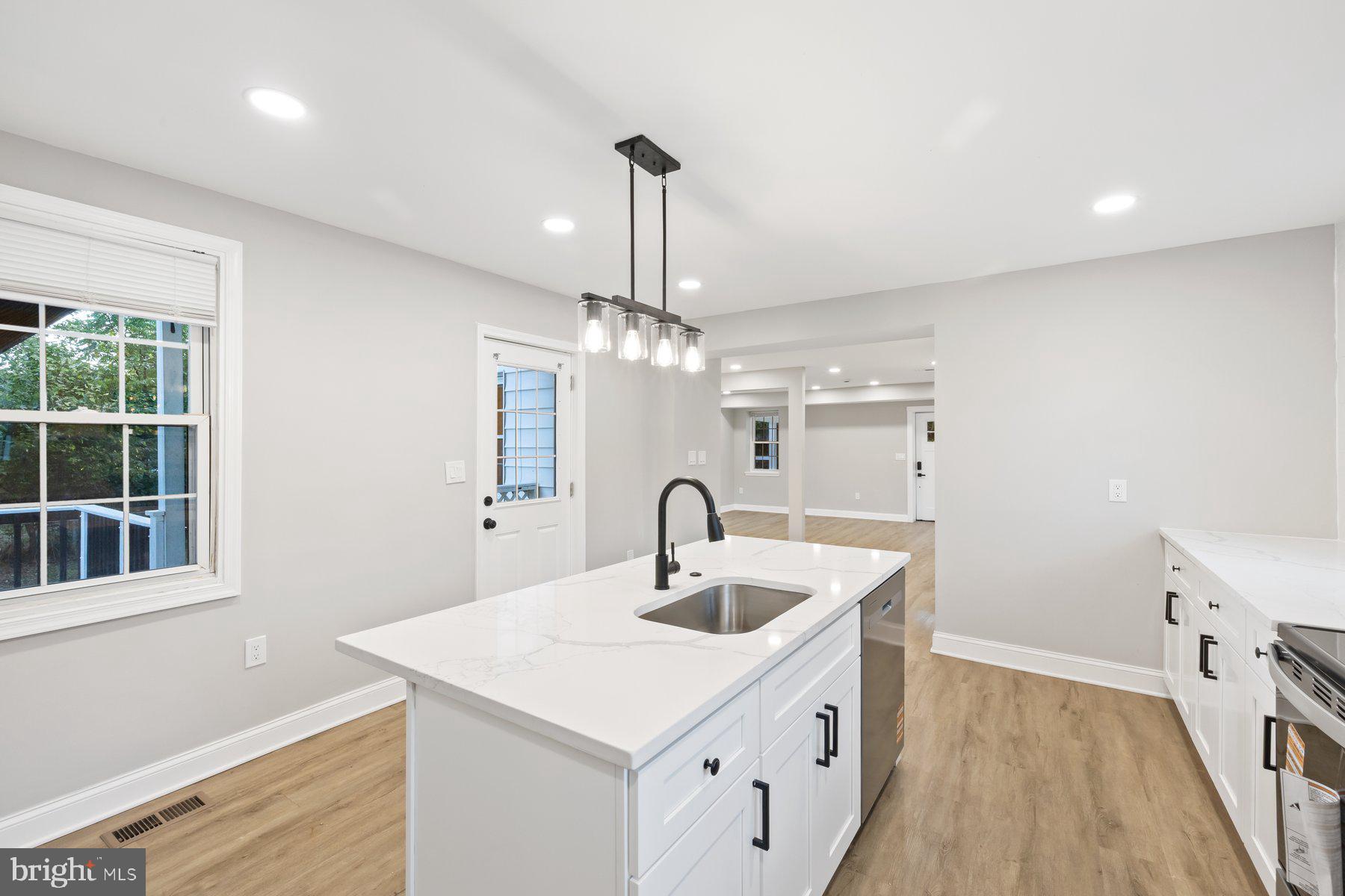 8109 Old Hagerstown Road Middletown, MD 21769 - Photo 10 of 54 a kitchen with a sink and chandelier