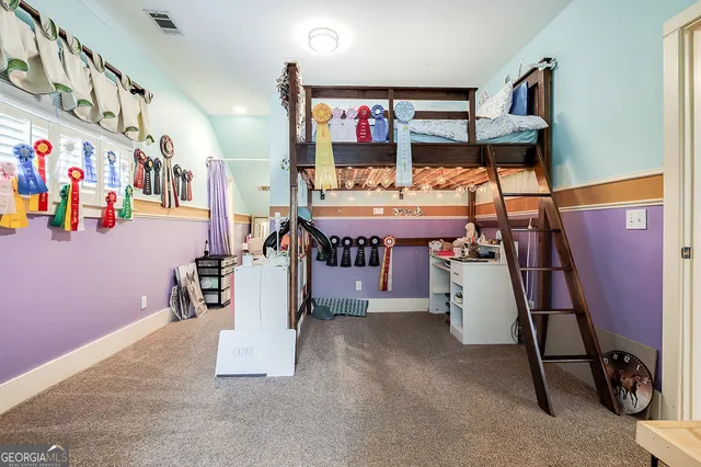 a living room with furniture ceiling fan and a window