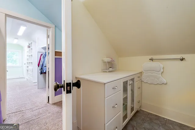 a terrace of a house with wooden floor and outdoor seating