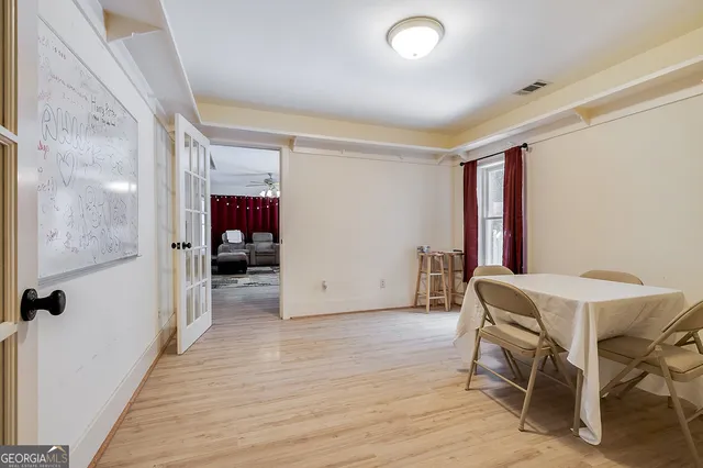 a bathroom with a sink mirror vanity and toilet