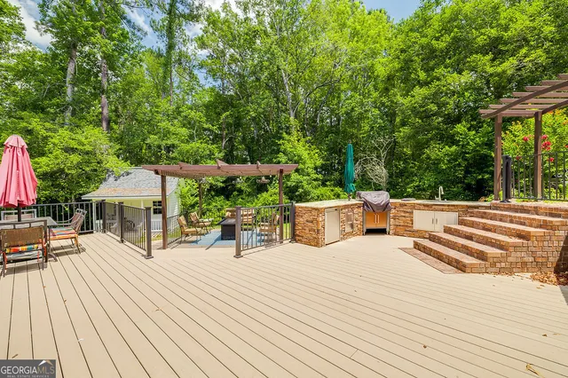 an aerial view of residential houses with trees and grass