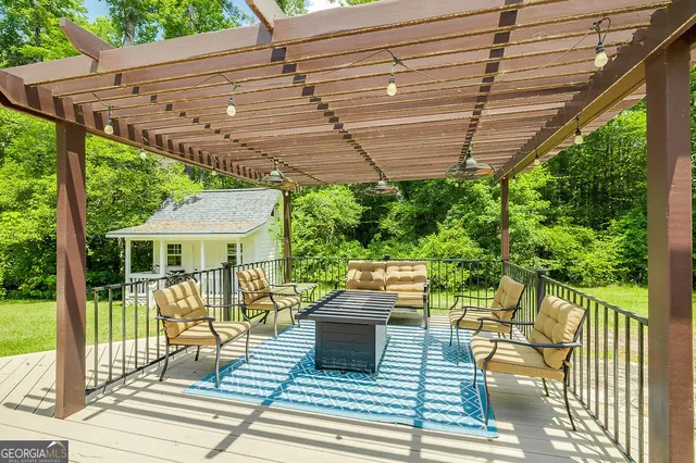 a view of a lush green forest with trees and grass
