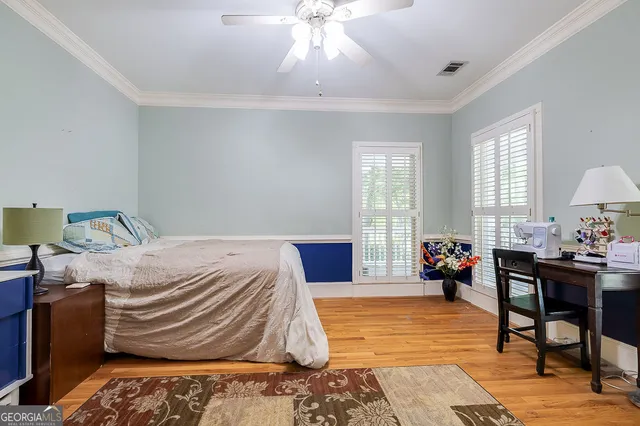 a kitchen with stainless steel appliances granite countertop a sink window and cabinets