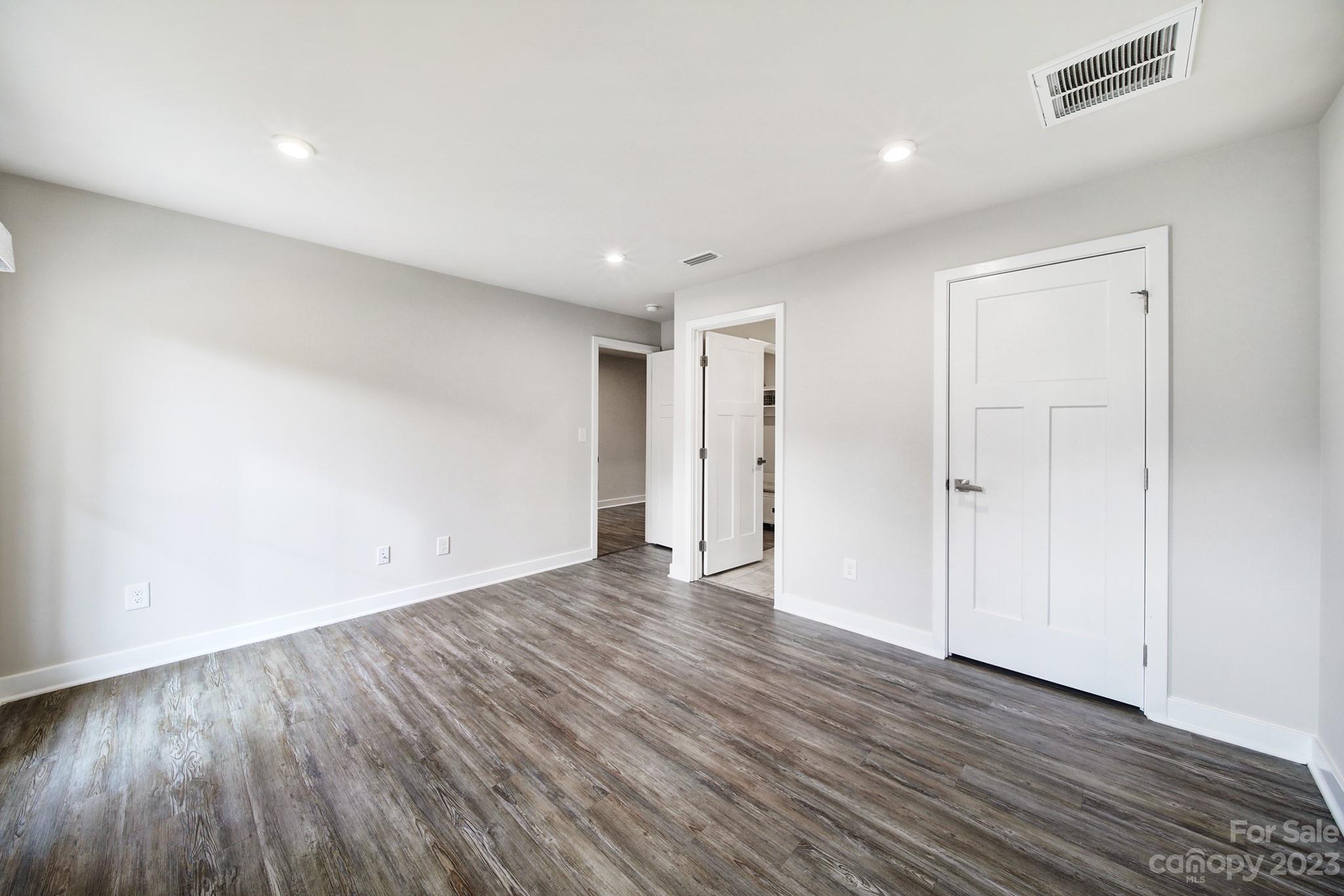 622 Crudent Road Tega Cay, SC 29708 - Photo 11 of 40 a view of an empty room with wooden floor