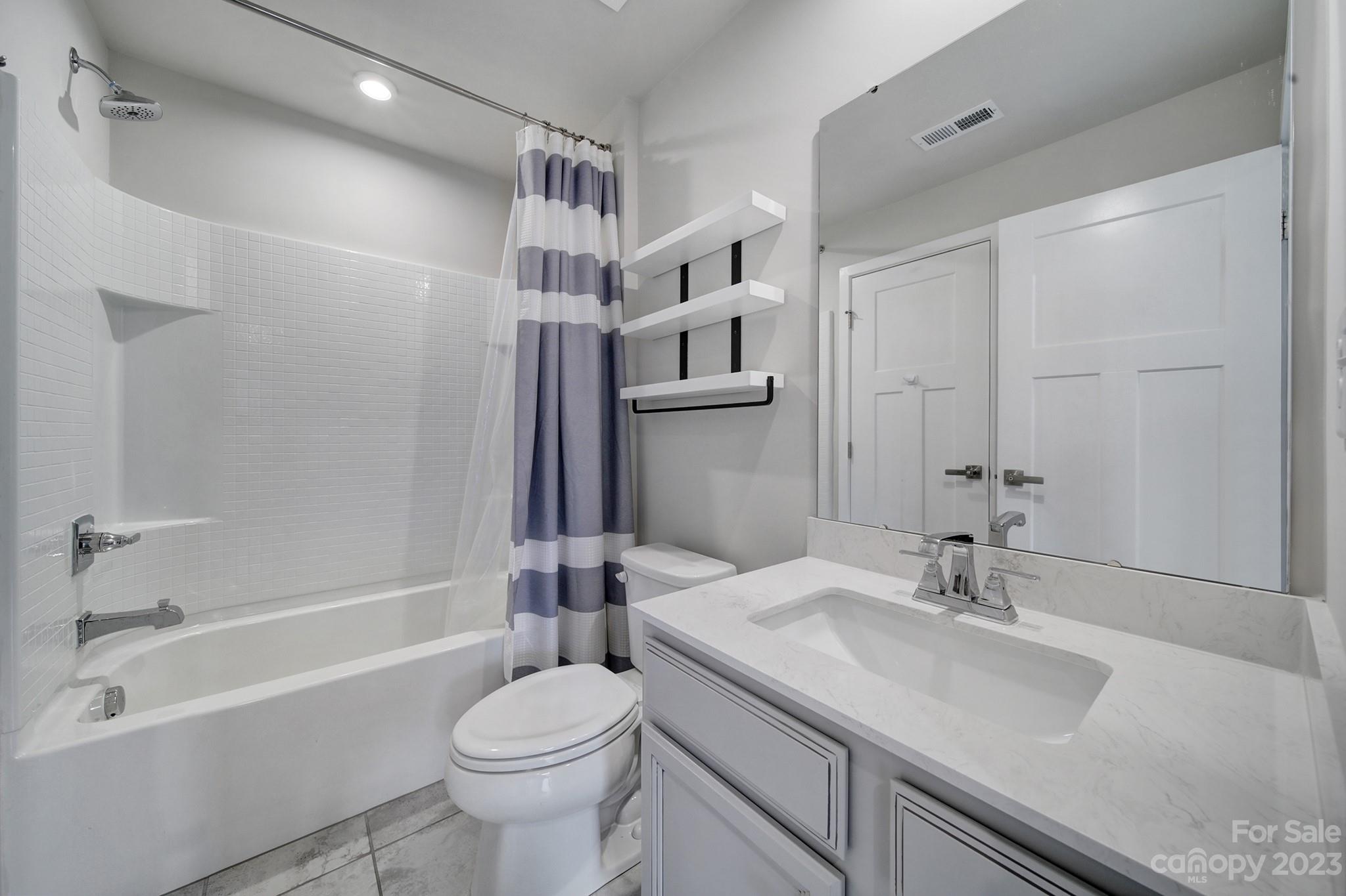 622 Crudent Road Tega Cay, SC 29708 - Photo 12 of 40 a bathroom with a sink toilet and shower
