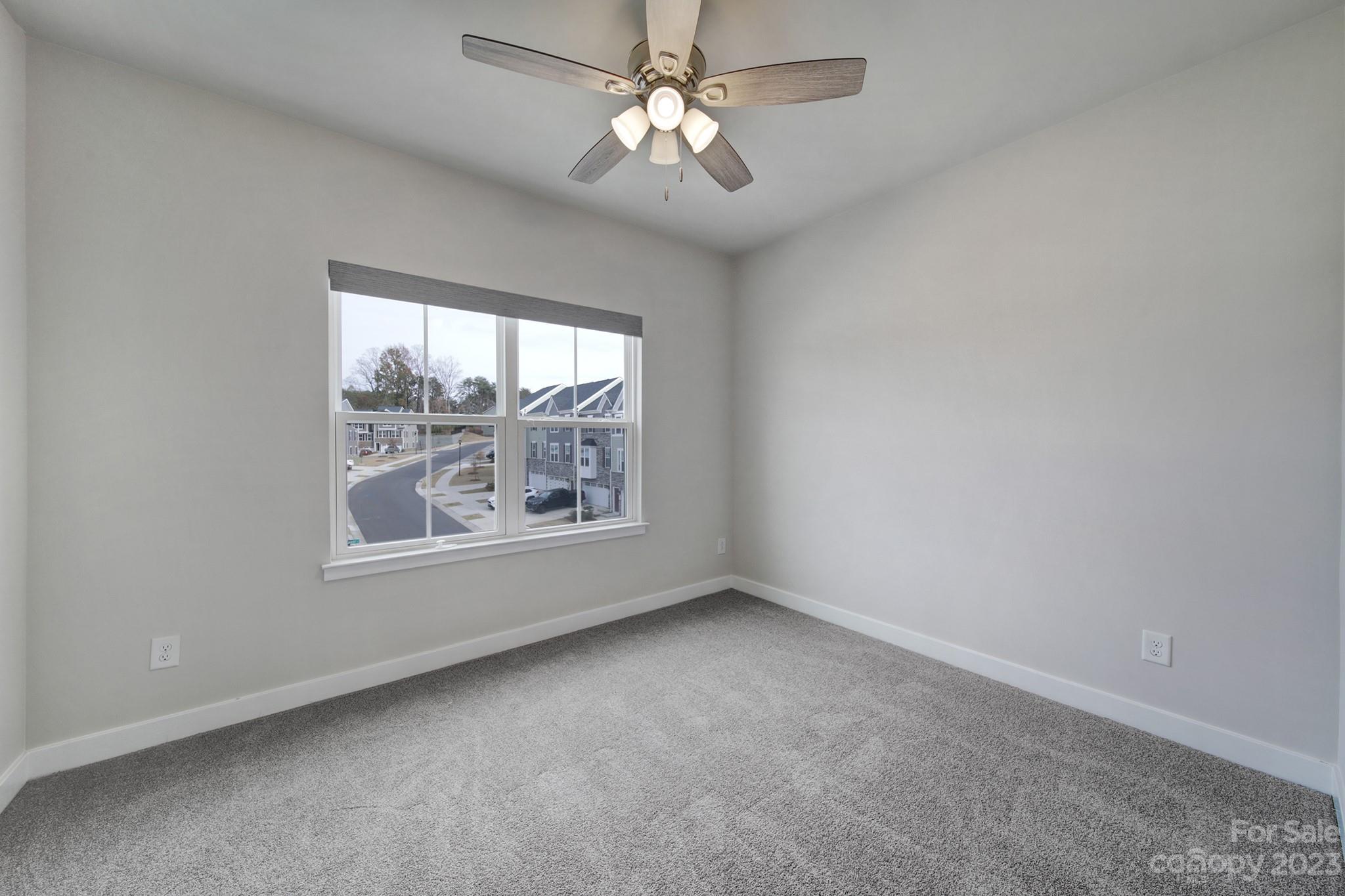 622 Crudent Road Tega Cay, SC 29708 - Photo 24 of 40 an empty room with a window and a fan