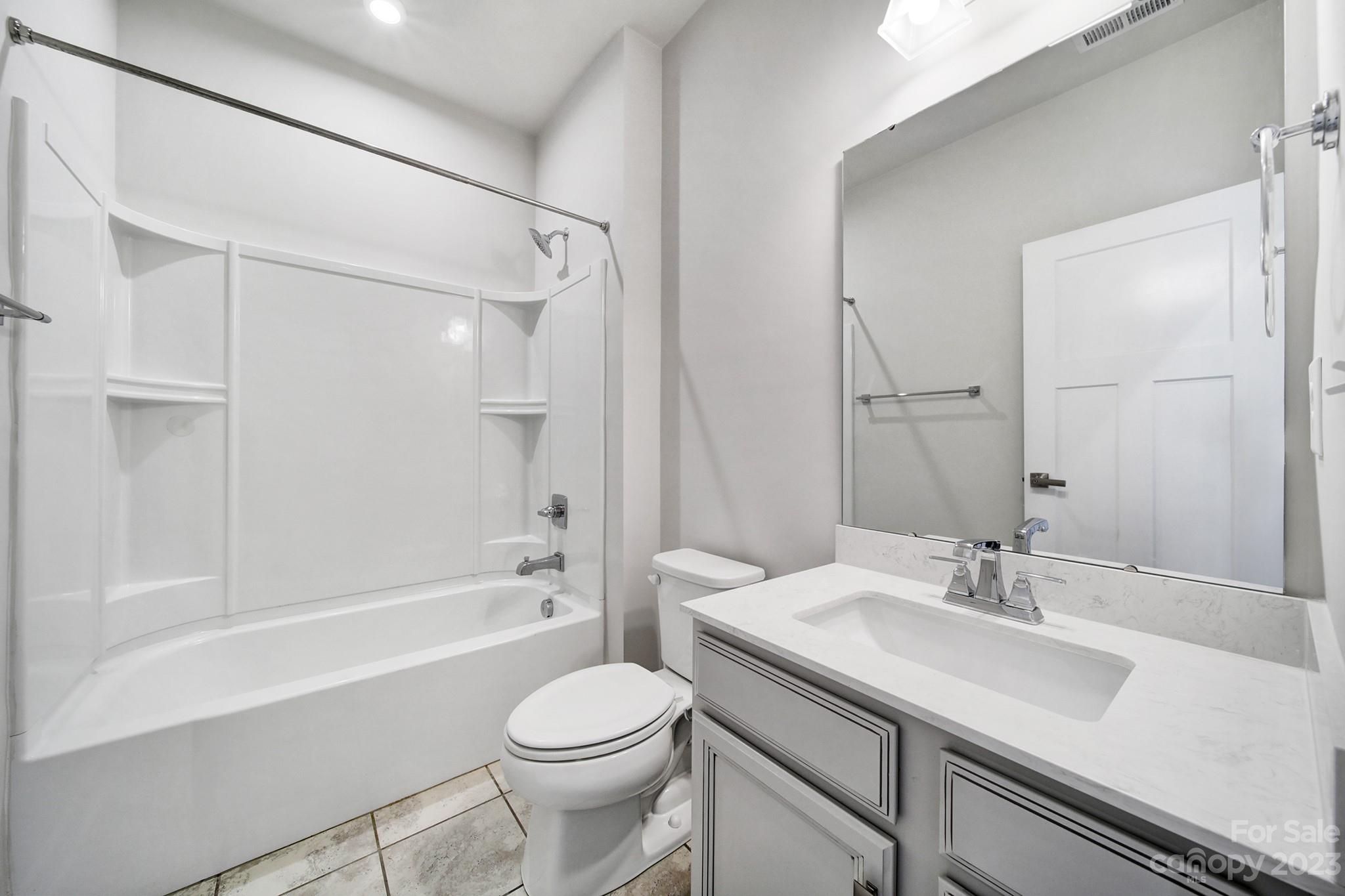 622 Crudent Road Tega Cay, SC 29708 - Photo 28 of 40 a bathroom with a sink a toilet and a bathtub