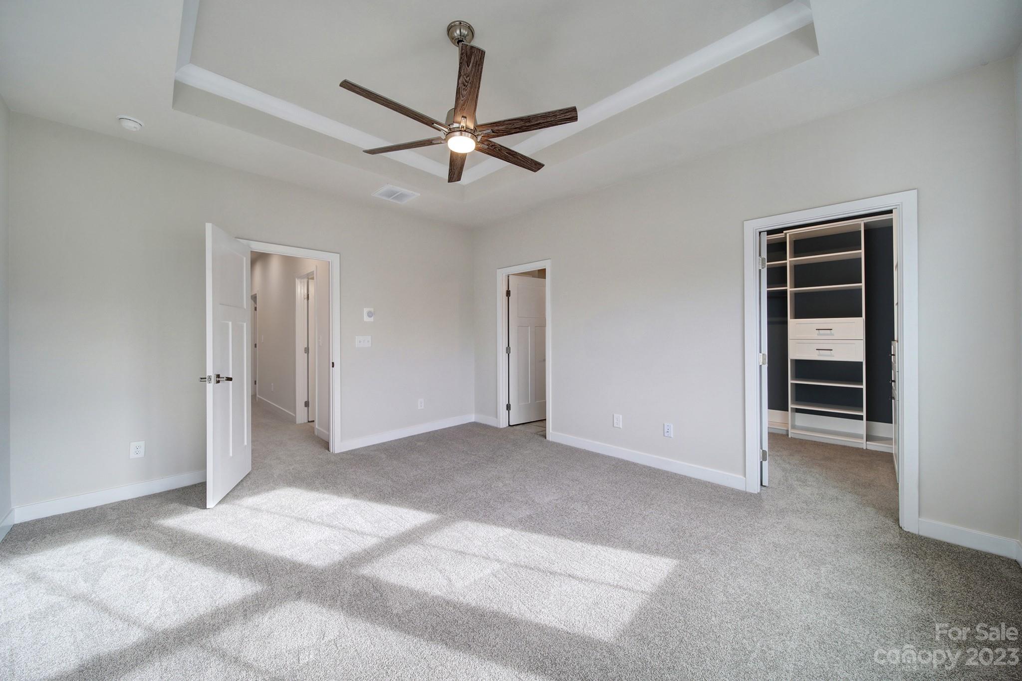 622 Crudent Road Tega Cay, SC 29708 - Photo 30 of 40 a view of a livingroom with a ceiling fan & windows