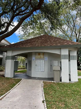 a view of a backyard with sitting area