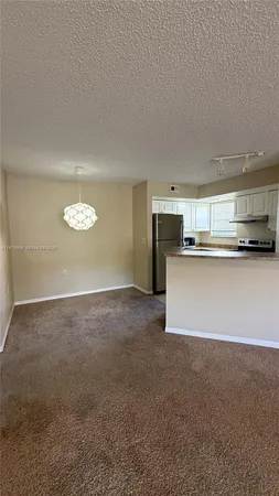 a view of a kitchen with a sink