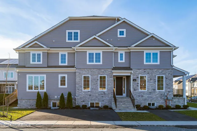 a view of a house with a yard porch and sitting area