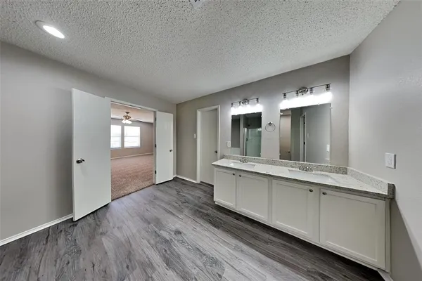 a bathroom with a sink and mirror