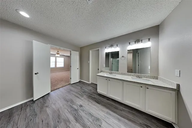 a bathroom with a sink and mirror
