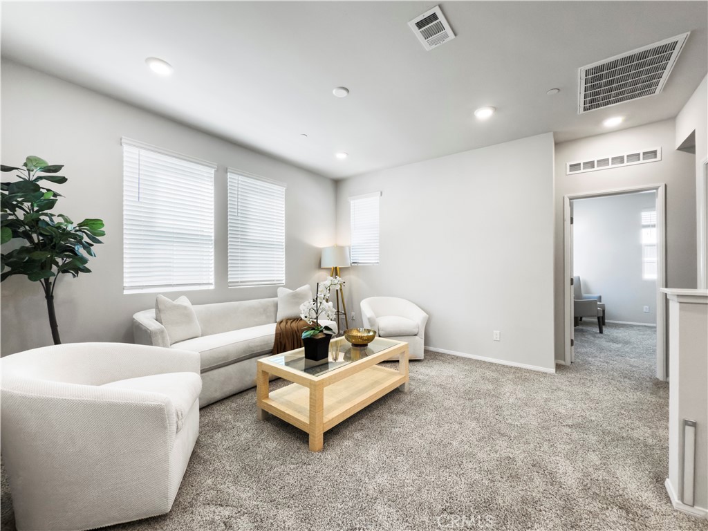 1162 Whirlwind Drive Rancho Mission Viejo, CA 92694 - Photo 9 of 27 a living room with furniture and a large window