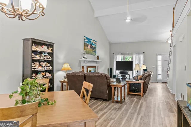 a living room with furniture fireplace and wooden floor