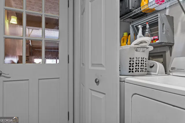 a utility room with dryer and washer
