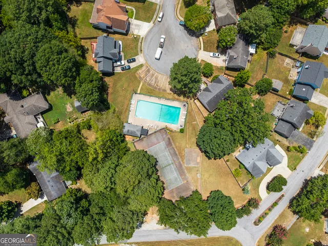 an aerial view of residential house with outdoor space and parking