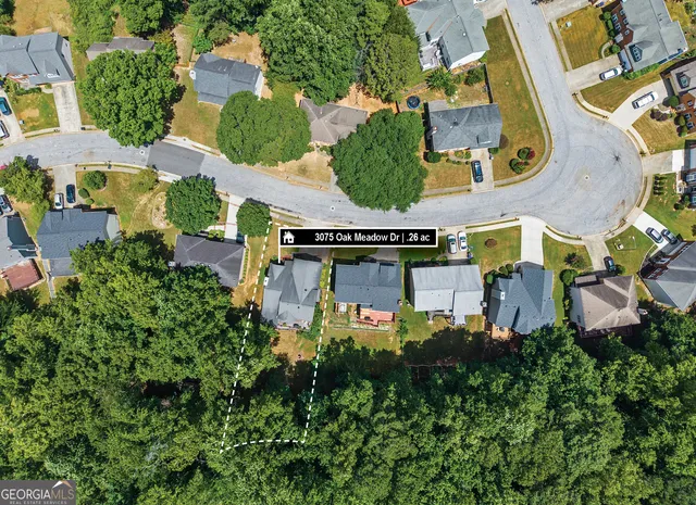 a front view of a house with a garden and yard