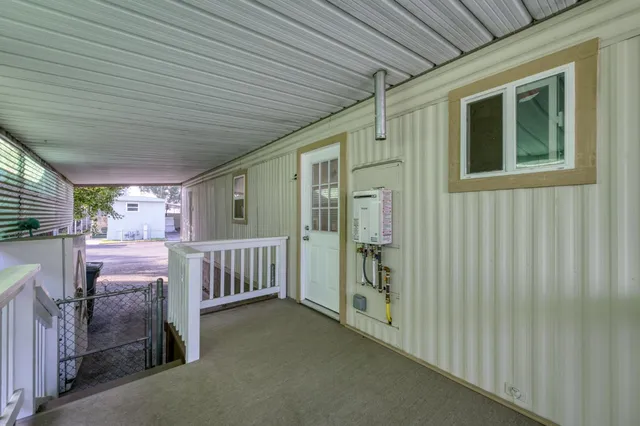 a front view of a house with a garden and porch