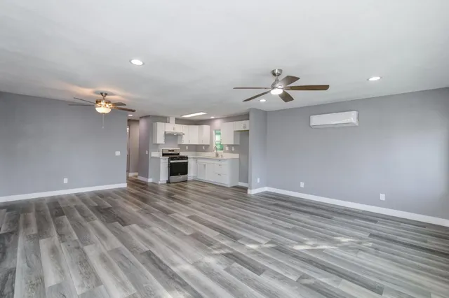 a kitchen with a stove top oven sink and cabinets
