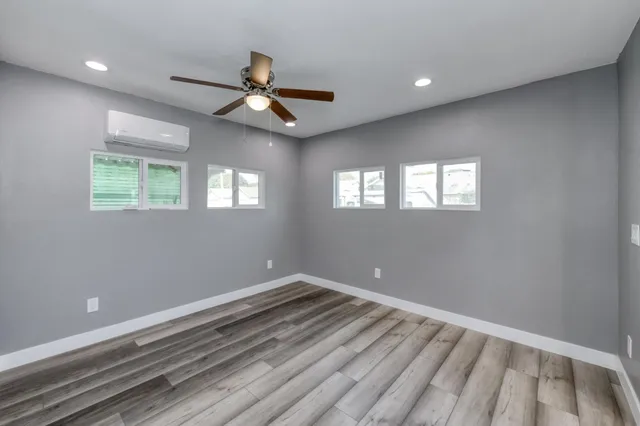 a bathroom with a sink double vanity granite tub and shower
