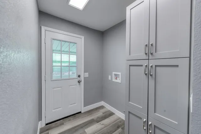 a view of a street with palm trees