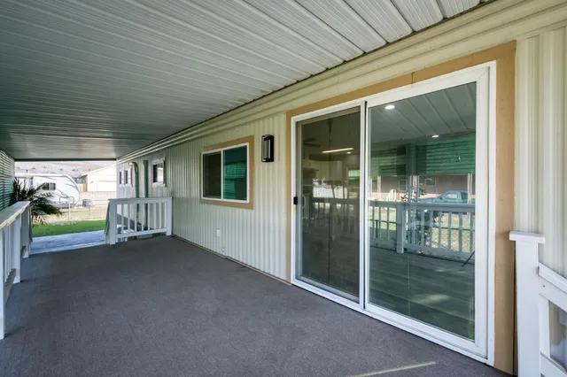 a view of a porch with wooden floor and outdoor space