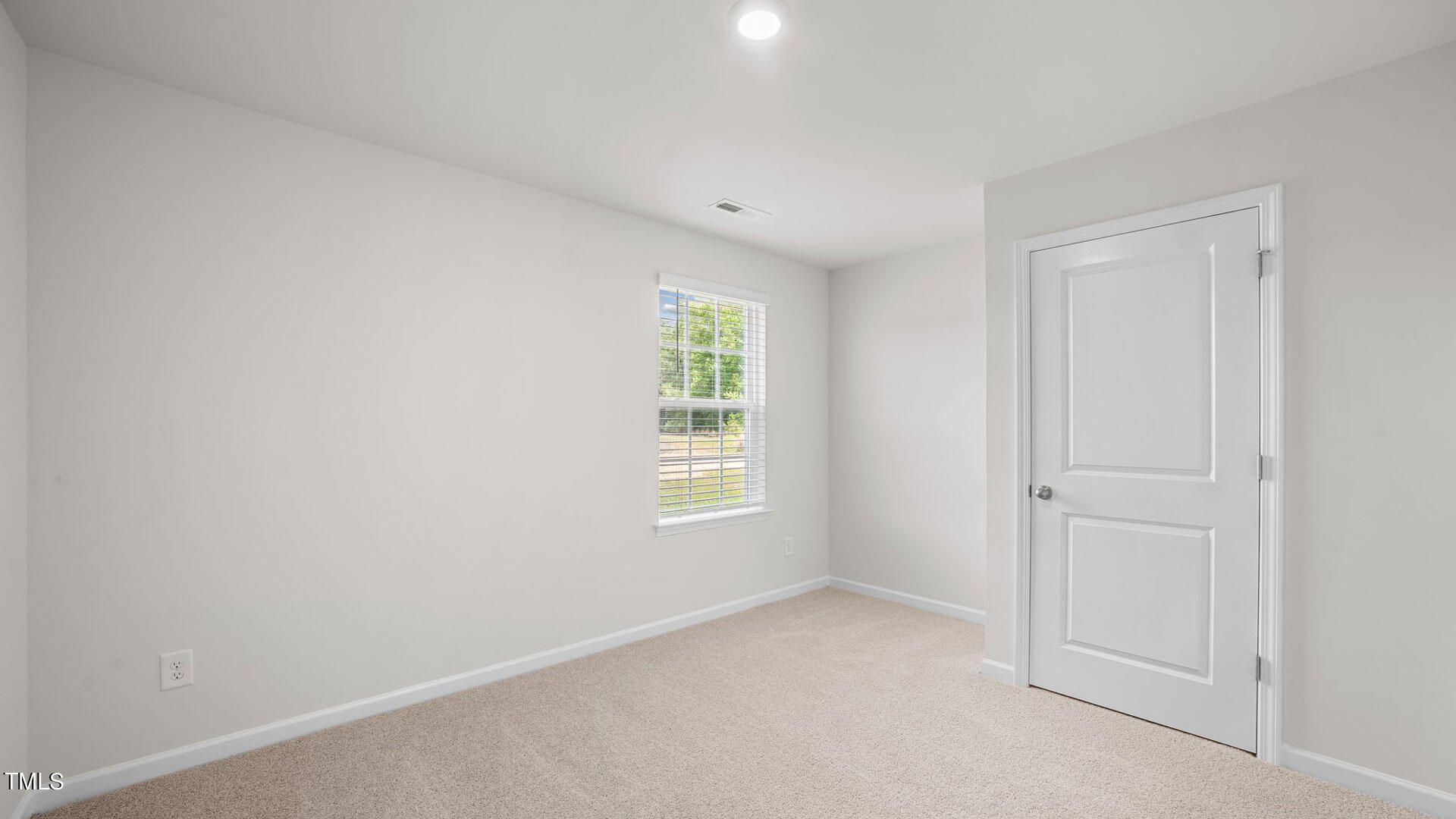 210 River Bank Road Fuquay-Varina, NC 27526 - Photo 13 of 36 an empty room with windows
