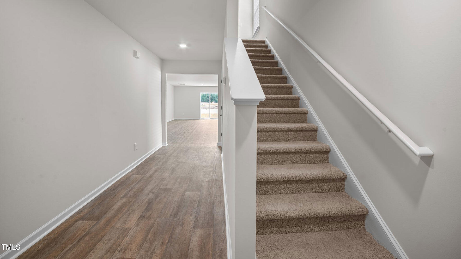 210 River Bank Road Fuquay-Varina, NC 27526 - Photo 20 of 36 a view of a hallway with wooden floor and entryway