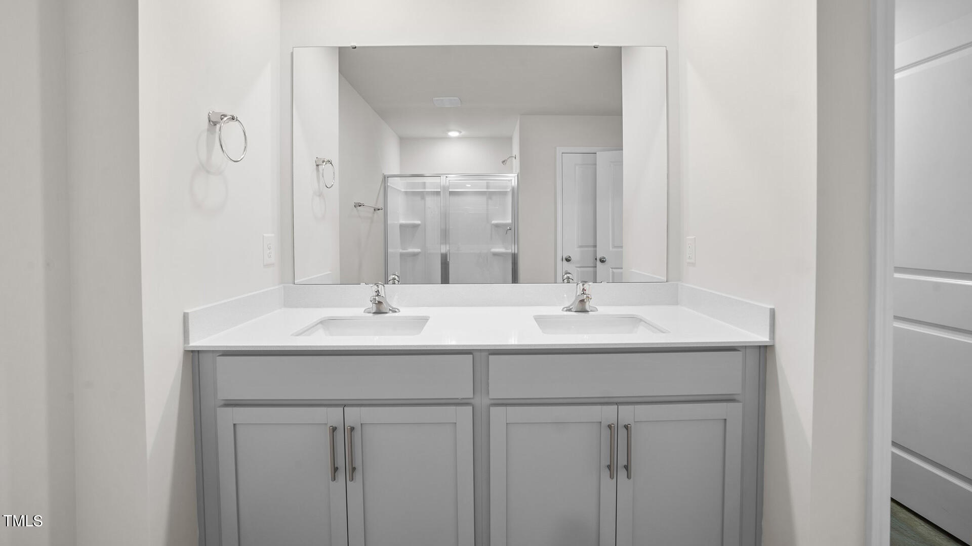 210 River Bank Road Fuquay-Varina, NC 27526 - Photo 25 of 36 a bathroom with double sink and a mirror