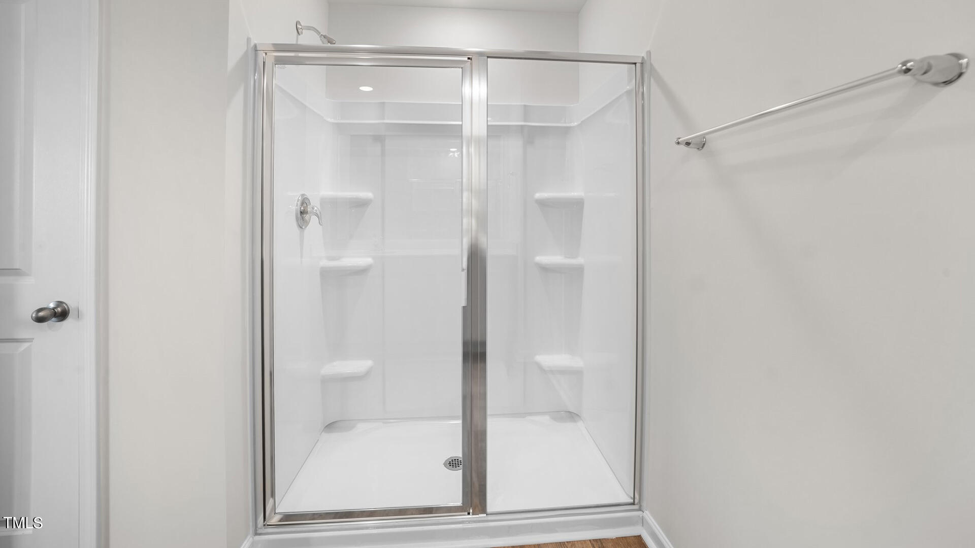 210 River Bank Road Fuquay-Varina, NC 27526 - Photo 26 of 36 a bathroom with a glass shower door