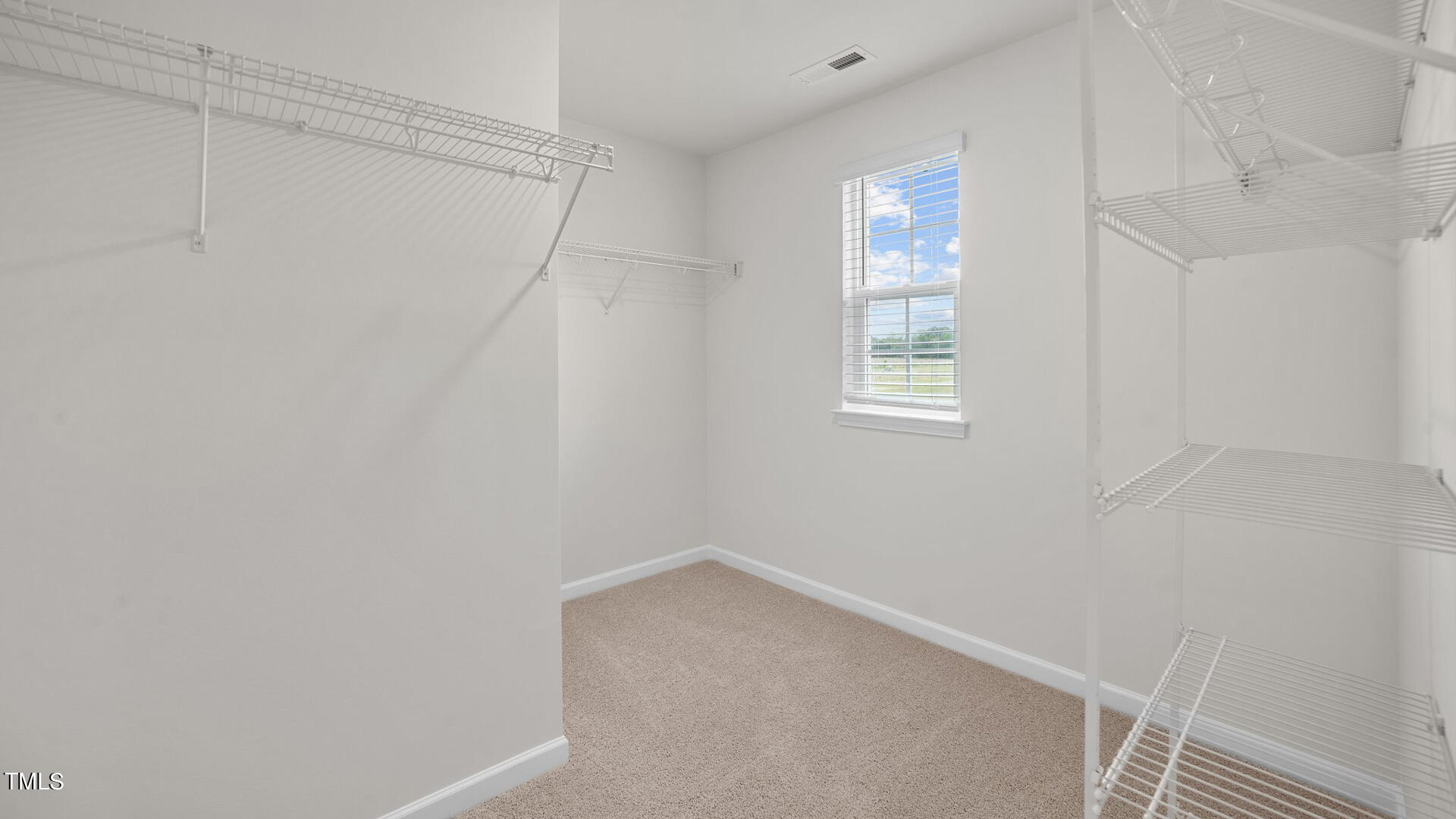 210 River Bank Road Fuquay-Varina, NC 27526 - Photo 27 of 36 a view of an empty room with windows